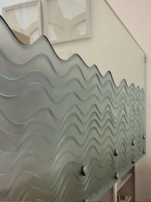 Decorative glass panel with wavy design.